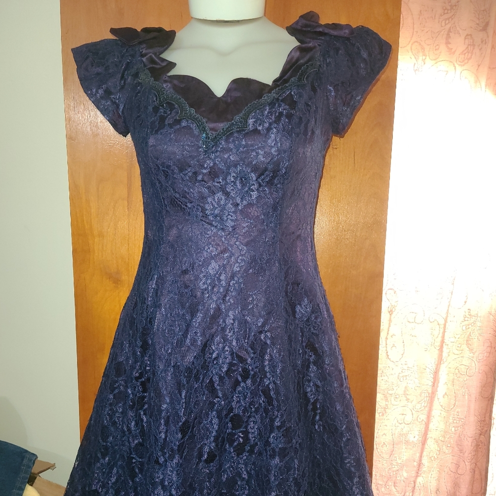 Blue lacey dress, size 13/14, satin bows on shoulders. Flowing dance dress,